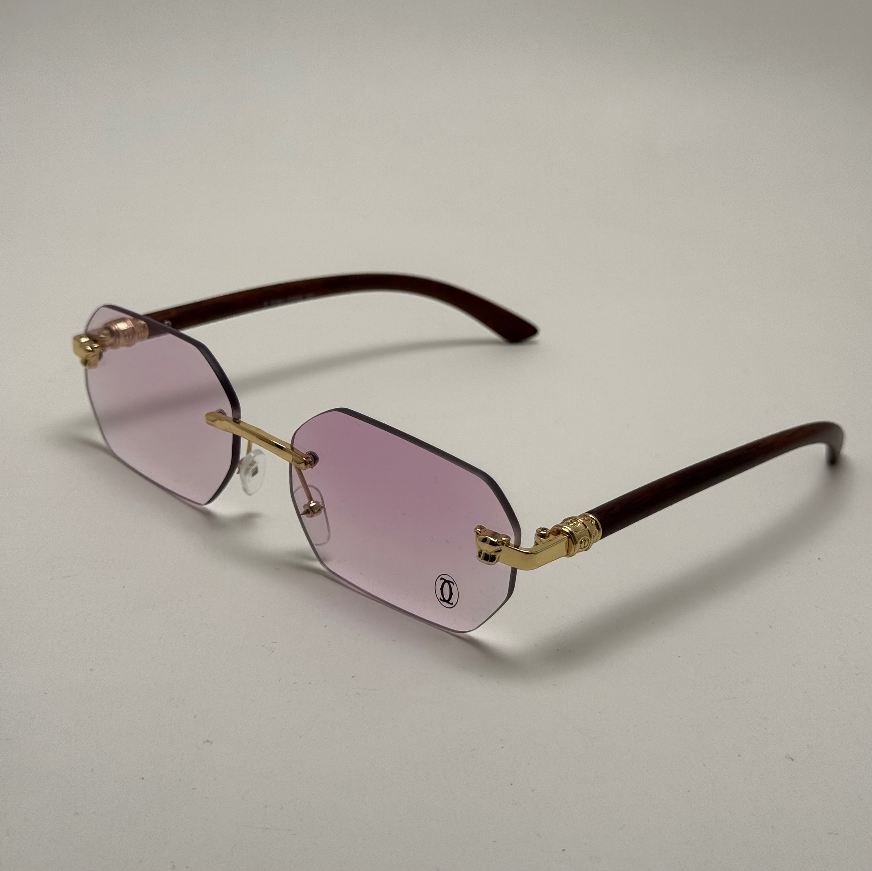 عینک آفتابی و شب کارتیر Cartier فریم لس فتوکرومیک تغییر رنگ عدسی در آفتاب UV400 بلوکات صورتی طلایی دسته طرح چوب